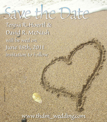 This beach Save the Date magnet features a heart carved out in the sand with